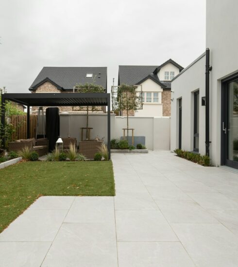 a house with a large yard and a covered patio